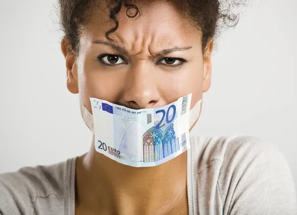 Covering mouth with a euro banknote — Stock Photo, Image