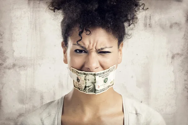 Covering mouth with a dollar banknote — Stock Photo, Image