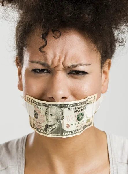 Covering mouth with a dollar banknote — Stock Photo, Image