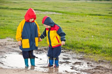 Boys in the puddle clipart