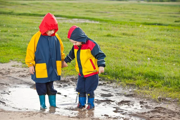 Boys in the puddle — Stock Photo, Image