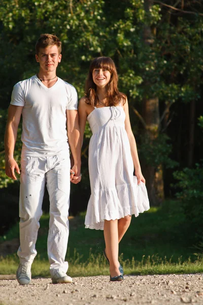 Couple walking outdoors together — Stock Photo, Image