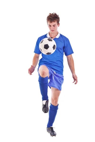 Fotbollsspelare med en boll Royaltyfria Stockbilder