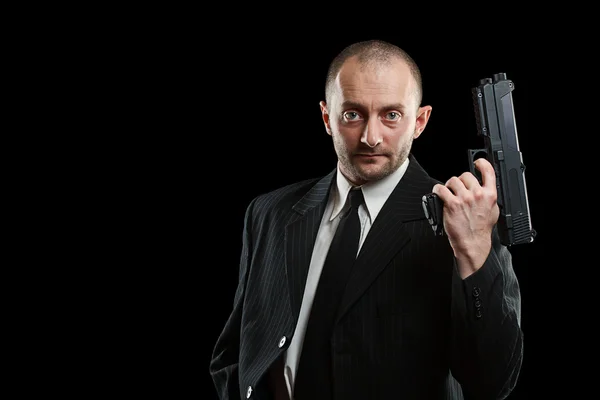 Homem de negócios com uma arma — Fotografia de Stock