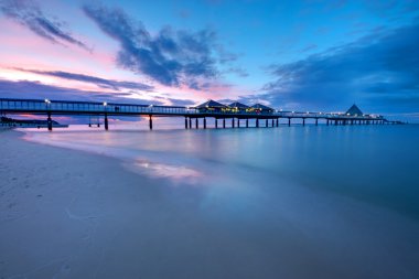 The pier of Heringsdorf at sunset clipart