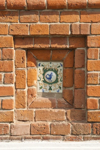 Tiles on a brick wall — Stock Photo, Image