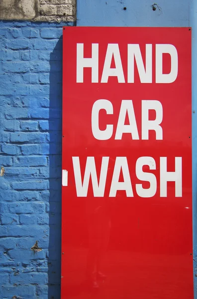 stock image Bright red hand car wash sign