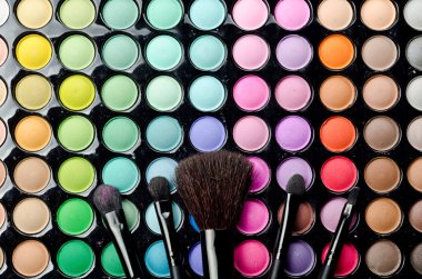 Multi colored make-up with brushes clipart