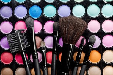 Multi colored make-up and brushes clipart