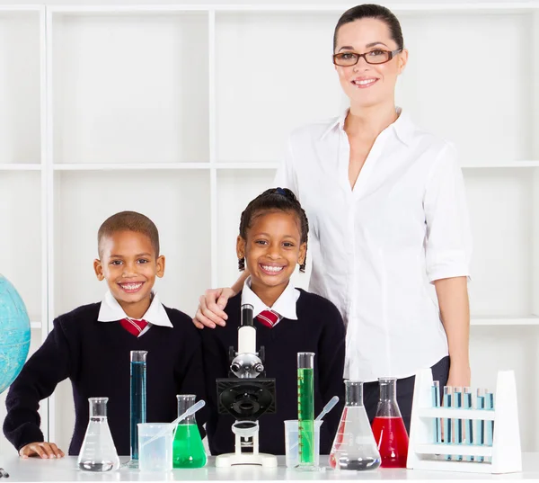 Portrait of primary teacher and students — Stock Photo, Image