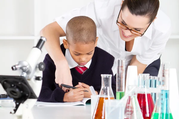 Elementary science teacher and student — Stock Photo, Image