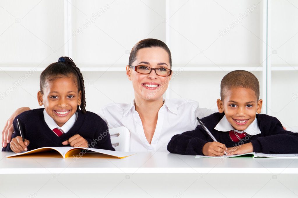 Caring primary teacher and students