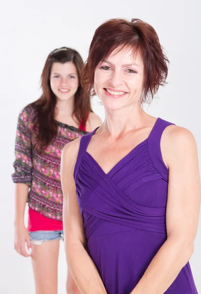 Happy teenager girl and middle aged mother — Stock Photo, Image