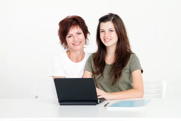 Middle aged mother help teen daughter studying computer — Stock Photo, Image