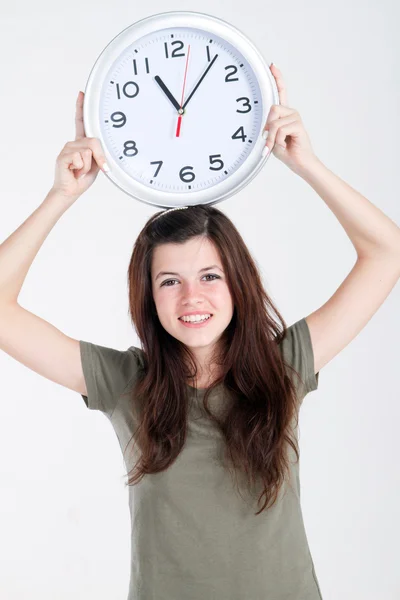 Teen girl with clock — Stock Photo, Image