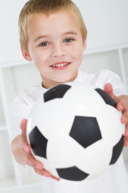 Happy boy with soccer ball clipart