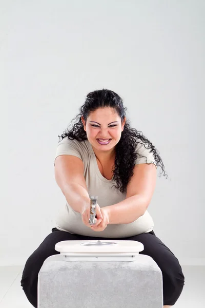 Overweight woman smash scale — Stock Photo, Image