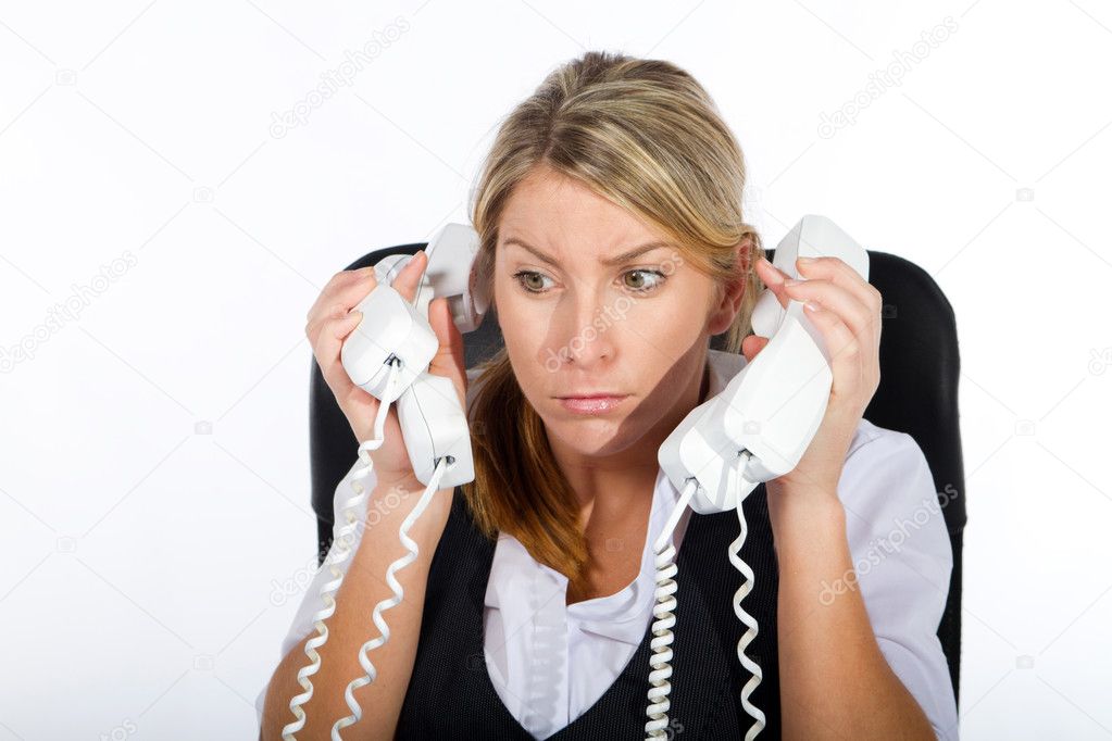 Businesswoman dealing with a lot of phone calls at same time