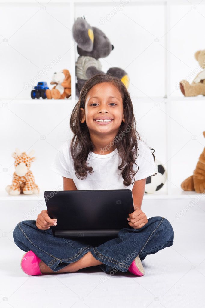 African american girl playing with laptop