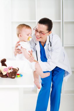 Female pediatrician and baby girl clipart