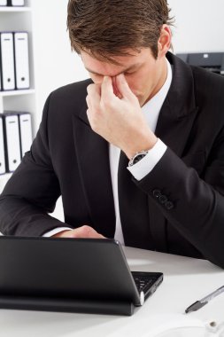 Stressful businessman at work clipart