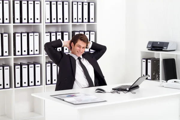 Relaxed businessman in office — Stok fotoğraf