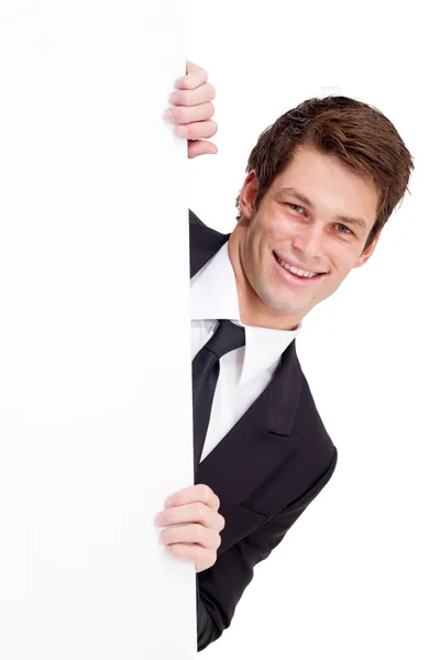 Young businessman holding a white board — Stock Photo, Image