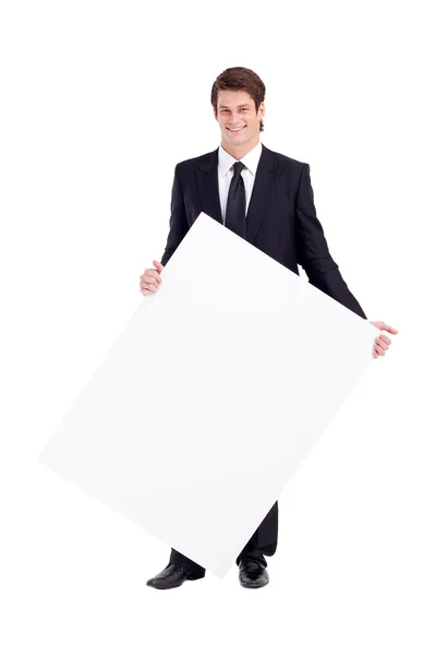 Mladý podnikatel drží bílou tabuli — Stock fotografie
