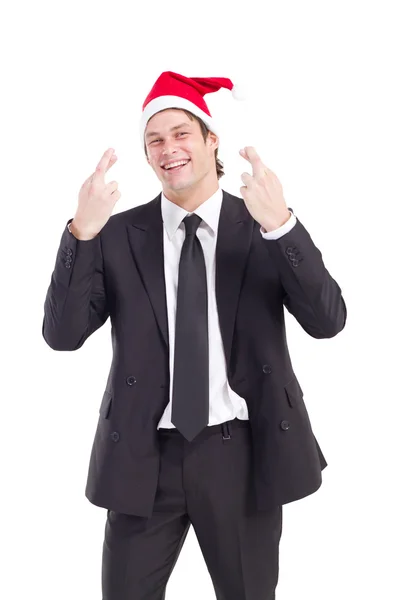 Businessman with Christmas hat cross fingers — Stock Photo, Image