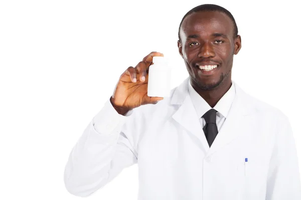 Lékárník drží láhev medicíny — Stock fotografie