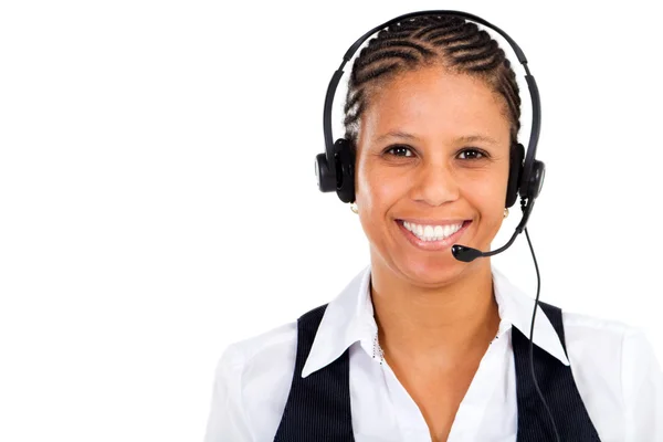 Mujer de negocios afroamericana con auriculares sonriendo —  Fotos de Stock