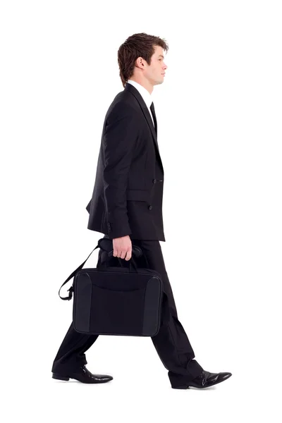 Young businessman with briefcase walking Stock Photo