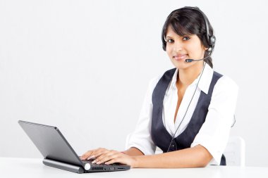 Happy indian call center operator with headset clipart