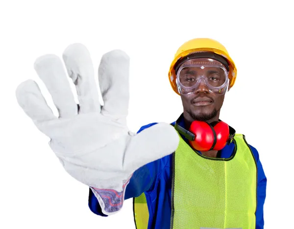 Африканский промышленный рабочий дает знак остановки — стоковое фото