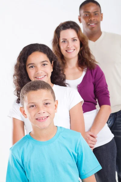 Happy multiracial family of four studio portrait — Stock Photo, Image