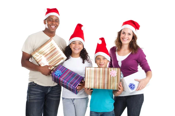 Família feliz de quatro prendendo presentes de Natal no branco — Fotografia de Stock