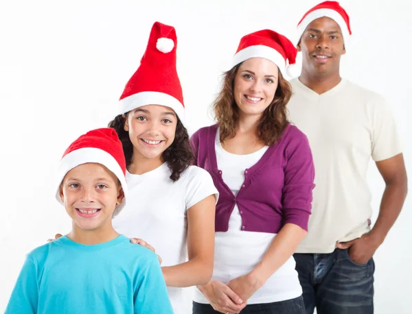 Feliz família multirracial de quatro usando chapéus de Papai Noel — Fotografia de Stock