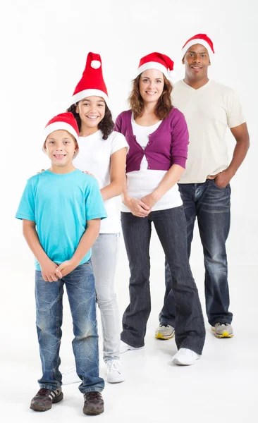 Feliz família multirracial de quatro usando chapéus de Papai Noel — Fotografia de Stock
