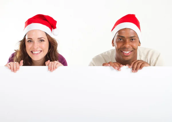 Uomo e donna con striscione natalizio — Foto Stock