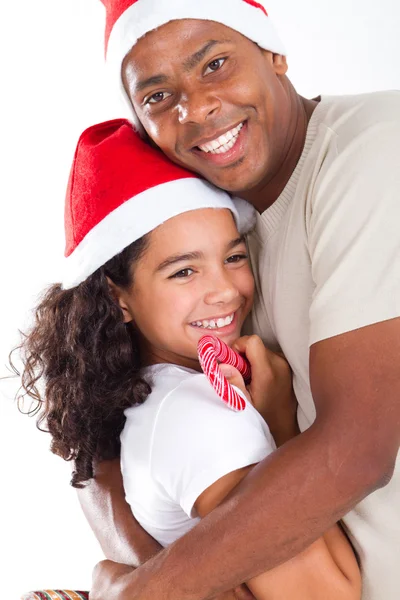 Lycklig far kramas dotter bär jul hatt — Stockfoto