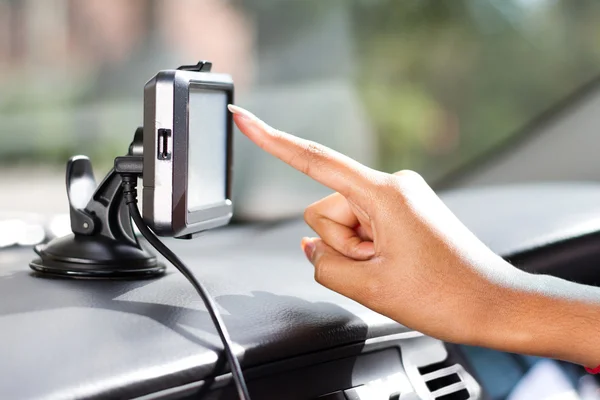 Finger pointing at car GPS navigation system — Stock Photo, Image