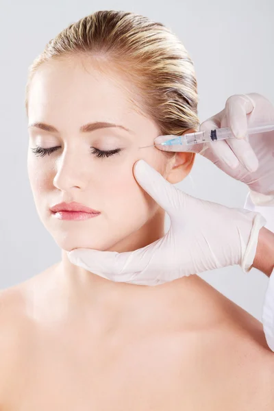Injection shot in the female face — Stock Photo, Image