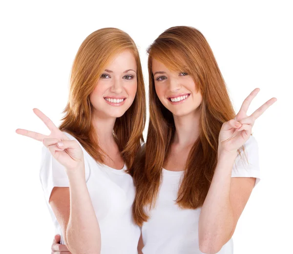 Young teen girl giving victory hand sign — Stock Photo, Image