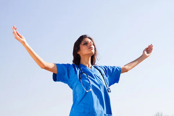Young female medical doctor with arms open — Stock Photo, Image