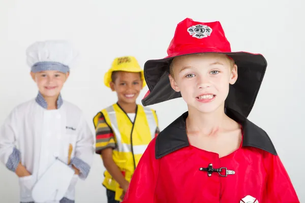 Malý chlapec jako hasič — Stock fotografie