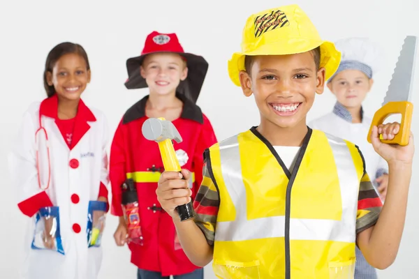 Grupo de pequenos trabalhadores felizes em vários uniformes — Fotografia de Stock