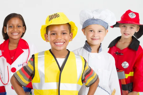 Grupo de pequenos trabalhadores felizes em vários uniformes — Fotografia de Stock