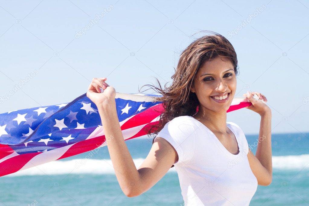 Beautiful young woman with american flag