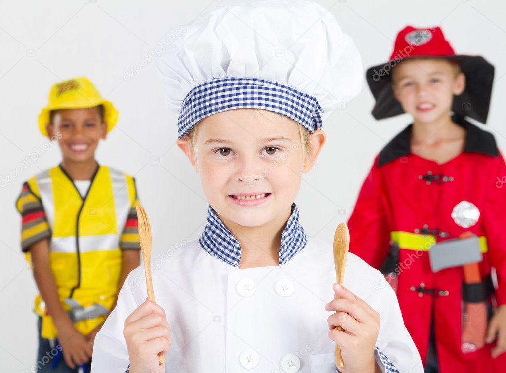 Happy little chef in front of construction worker and fireman