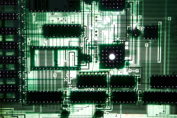 Close up of computer circuit board in green — Stock Photo, Image